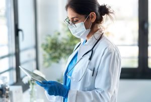 Foot surgery specialist looking at a chart